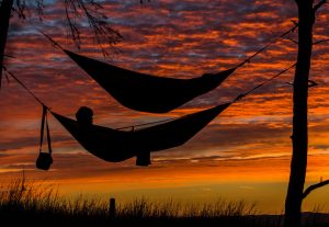 Hammocks in a sunset might help low back pain!